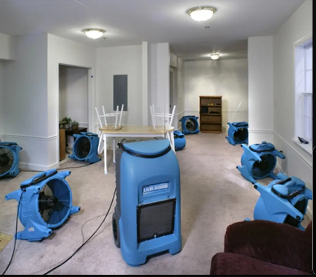 Air movers and dehumidifier setup for Water Damage Restoration in Winchester